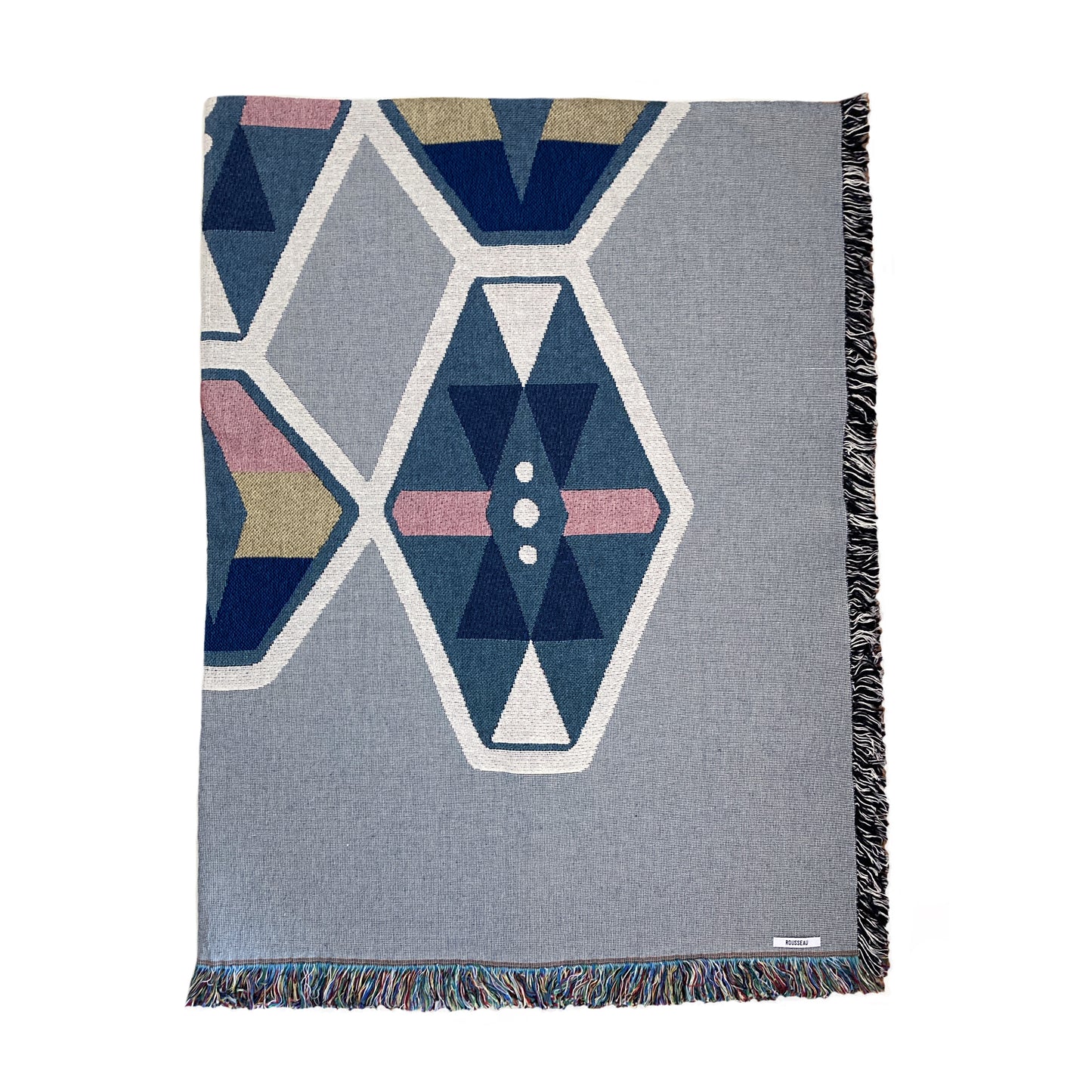 A fog gray and indigo woven throw blanket with a geometric pattern and fringe edge.