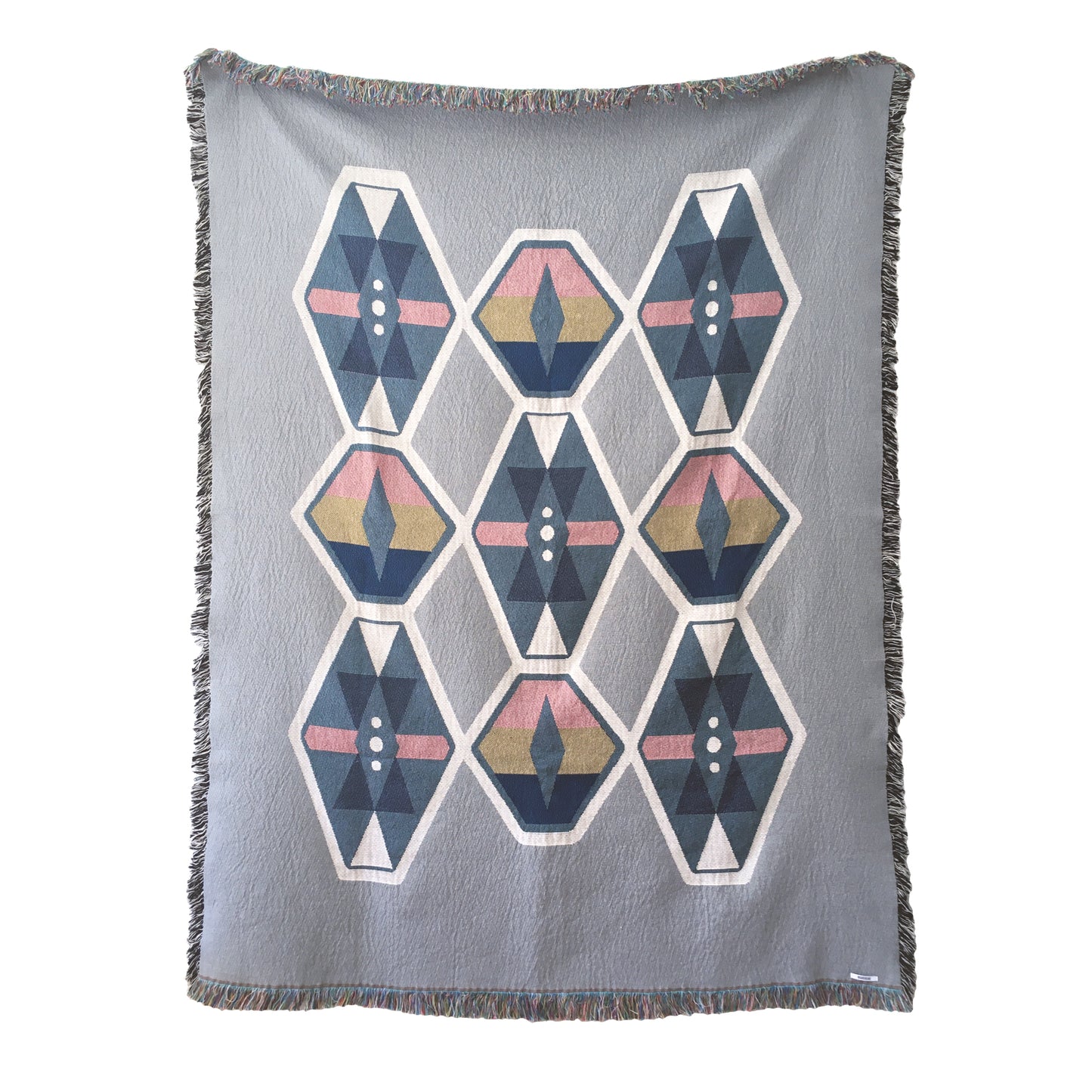 Fog gray geo woven throw with fringe edge. Woven with recycled cotton on a jacquard loom, made in the US. Each throw measures 54 x 72 inches.