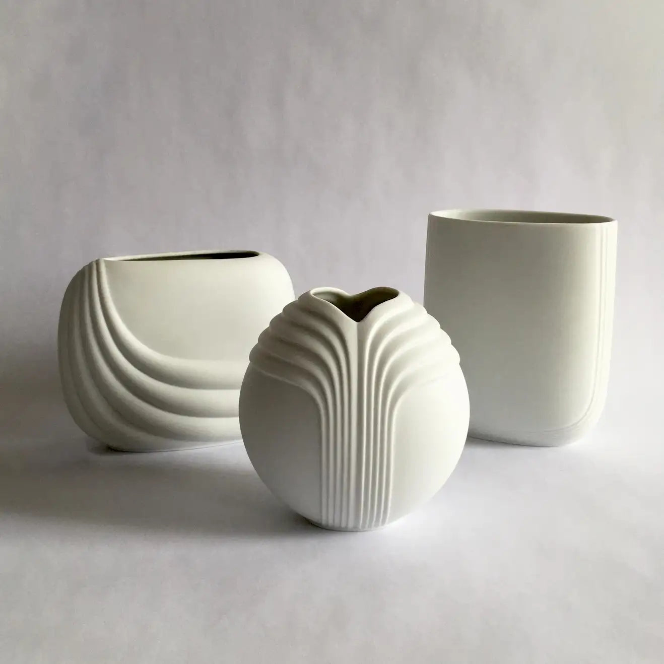 Rosenthal Studio line white porcelain bisque vase by Uta Feyl. Unglazed porcelain exterior, clear glazed interior. Stunning curved geometric shape.