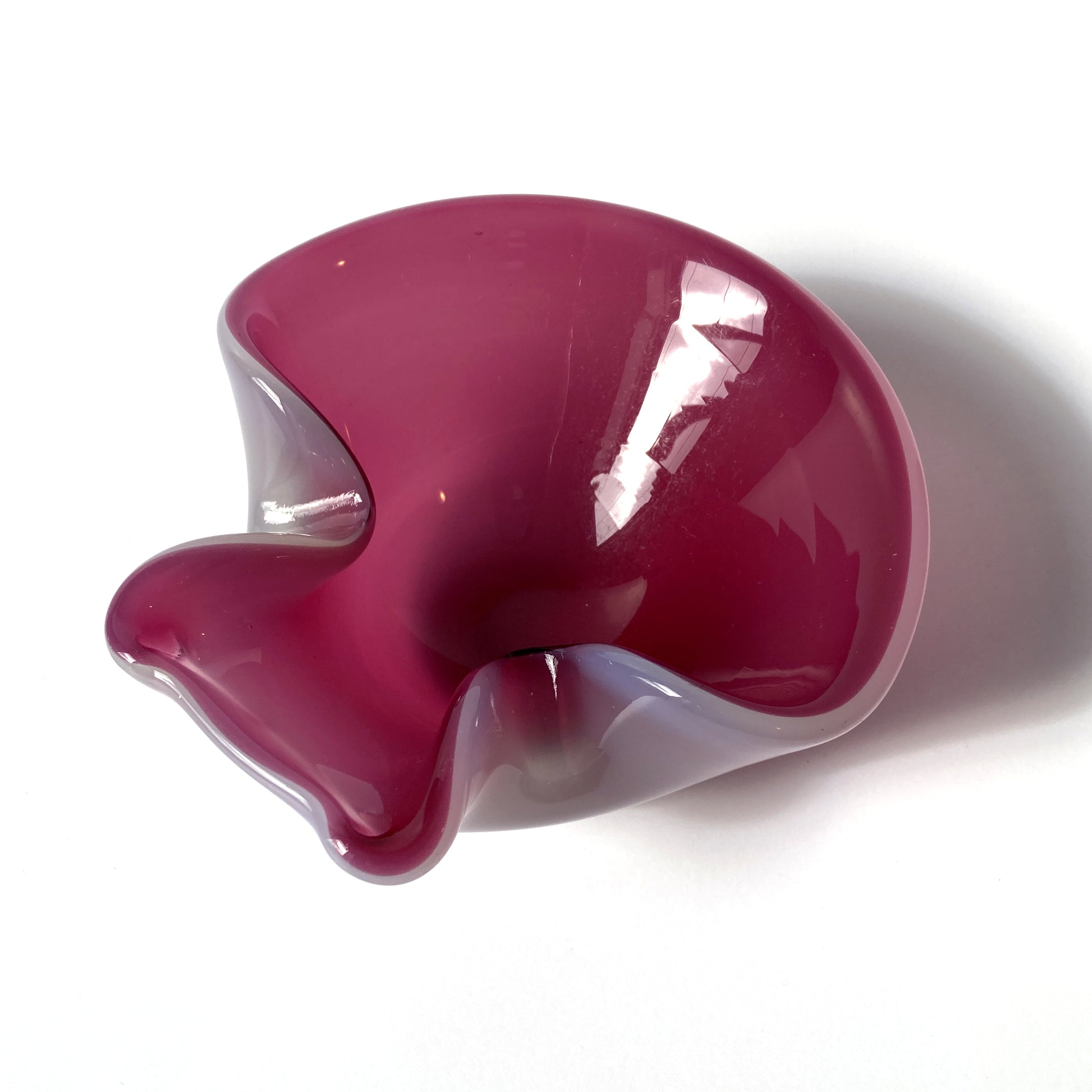 Stunning, unique Venetian hand blown bowl/ catchall. Beautiful cranberry pink interior with opal exterior, creating a luminous mauve shade. 