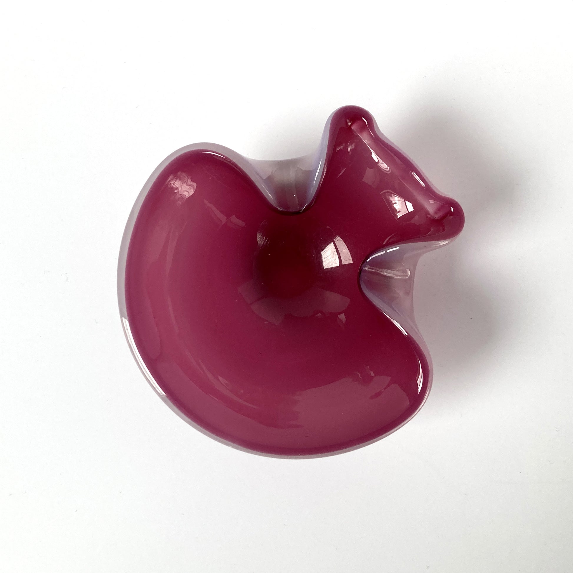 Stunning, unique Venetian hand blown bowl/ catchall. Beautiful cranberry pink interior with opal exterior, creating a luminous mauve shade. 