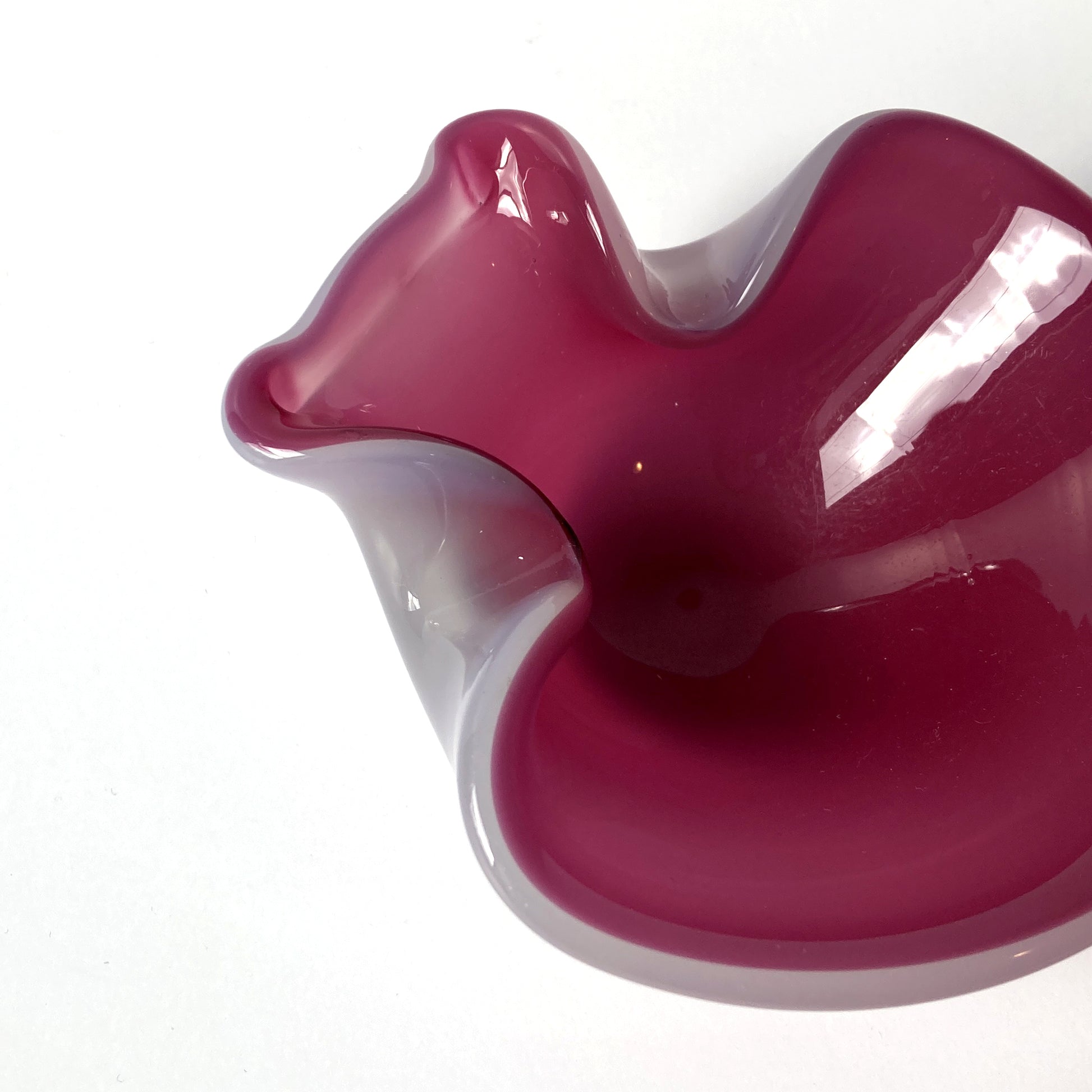 Stunning, unique Venetian hand blown bowl/ catchall. Beautiful cranberry pink interior with opal exterior, creating a luminous mauve shade. 