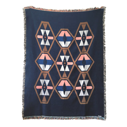 Twilight navy geo woven throw with fringe edge. Woven with recycled cotton on a jacquard loom, made in the US. Each throw measures 54 x 72 inches.